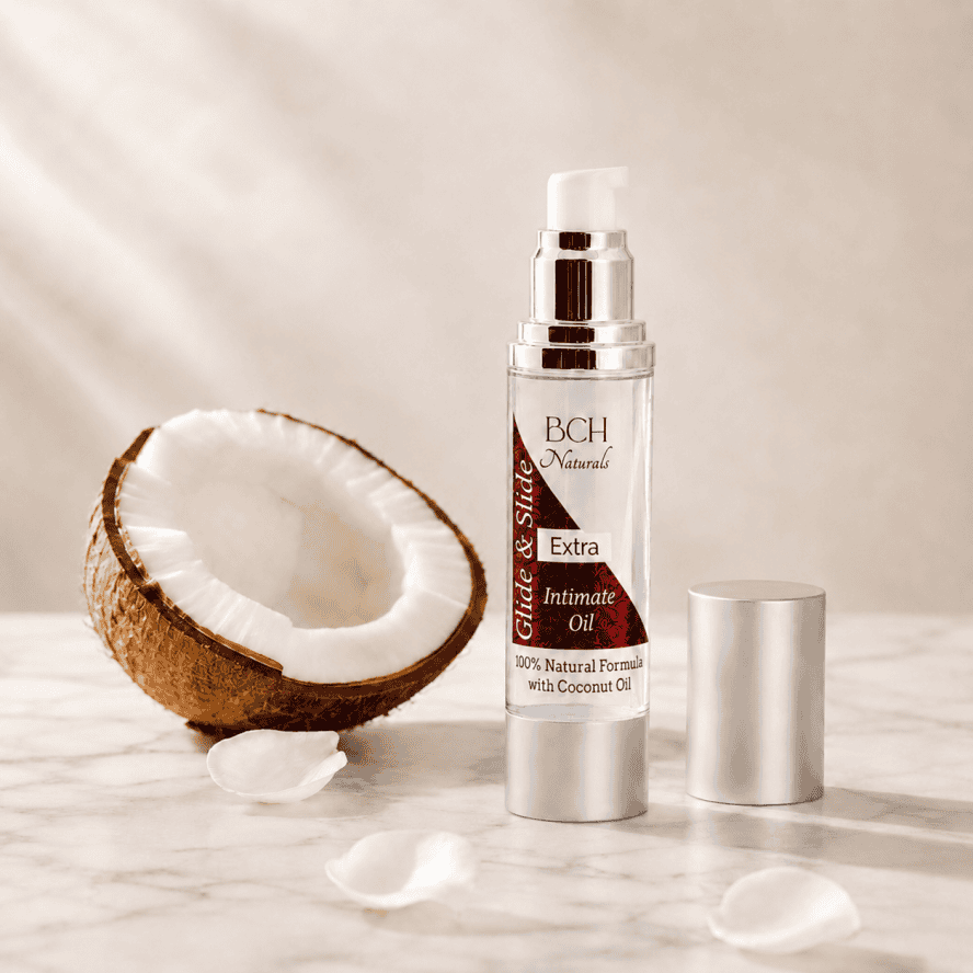 Glide & Slide Intimate Oil with coconut half with white rose petals