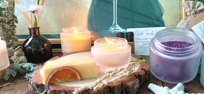 Sideboard with painting with a candle, soap and plants