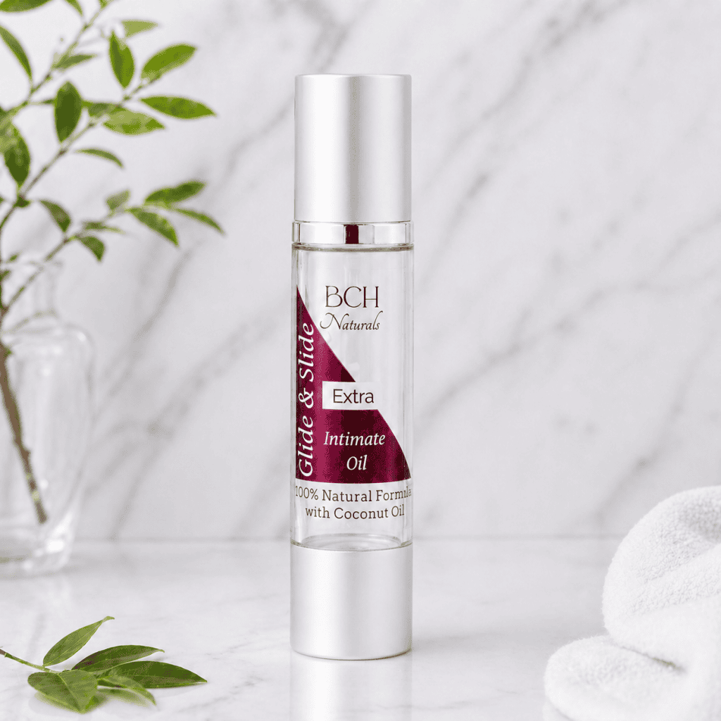BCH Naturals Slide & Glide Extra Intimate Oils pleasure oils in marble surround with spa towel