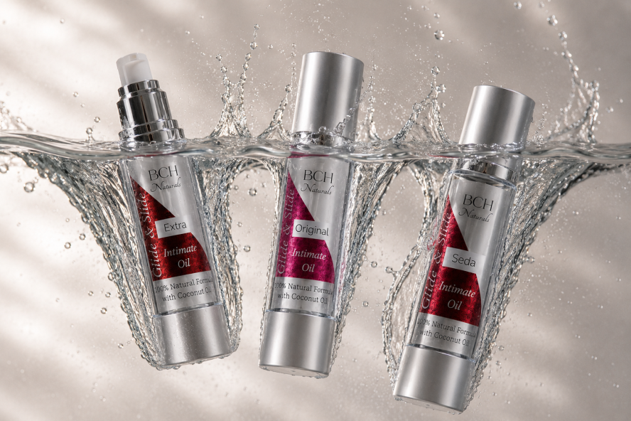Three bottles of Glide & Slide Original & Extra intimate oils splashing into oil