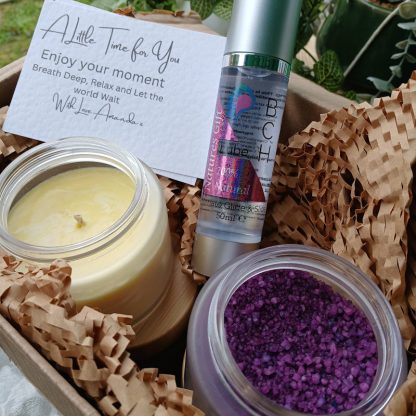 Bath Salts in a jar, with Body Glide Oil and a candle in a brown box with honeycomb packaging