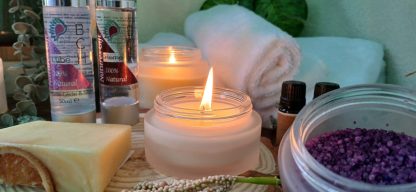 Sideboard view of Salts in a jar, a candle rolled up white towel