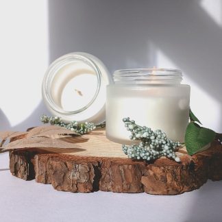 natural spa candle on a slice of wood