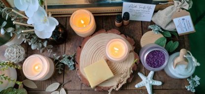 Lifestyle image side board with candles alight soap and a white star fish ornament