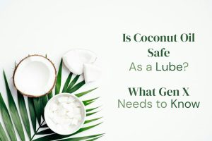 Coconut slices and palm leaves arranged on a white background, used as the header image for an article about whether coconut oil is safe as a lube for Gen X